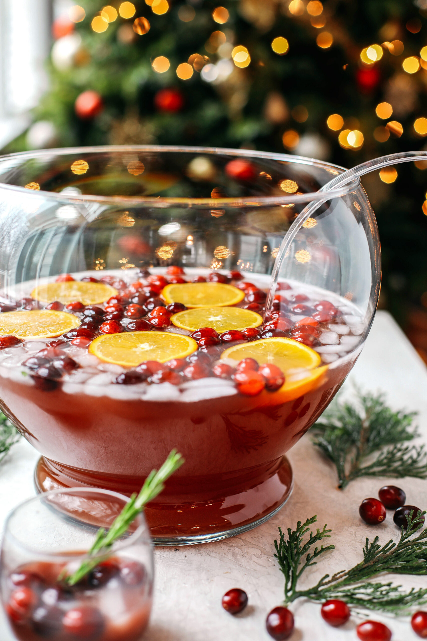 This Sparkling Christmas Punch makes the perfect addition to any holiday party or gathering with a delicious blend of cranberries and oranges all marinated together in one festive cocktail!