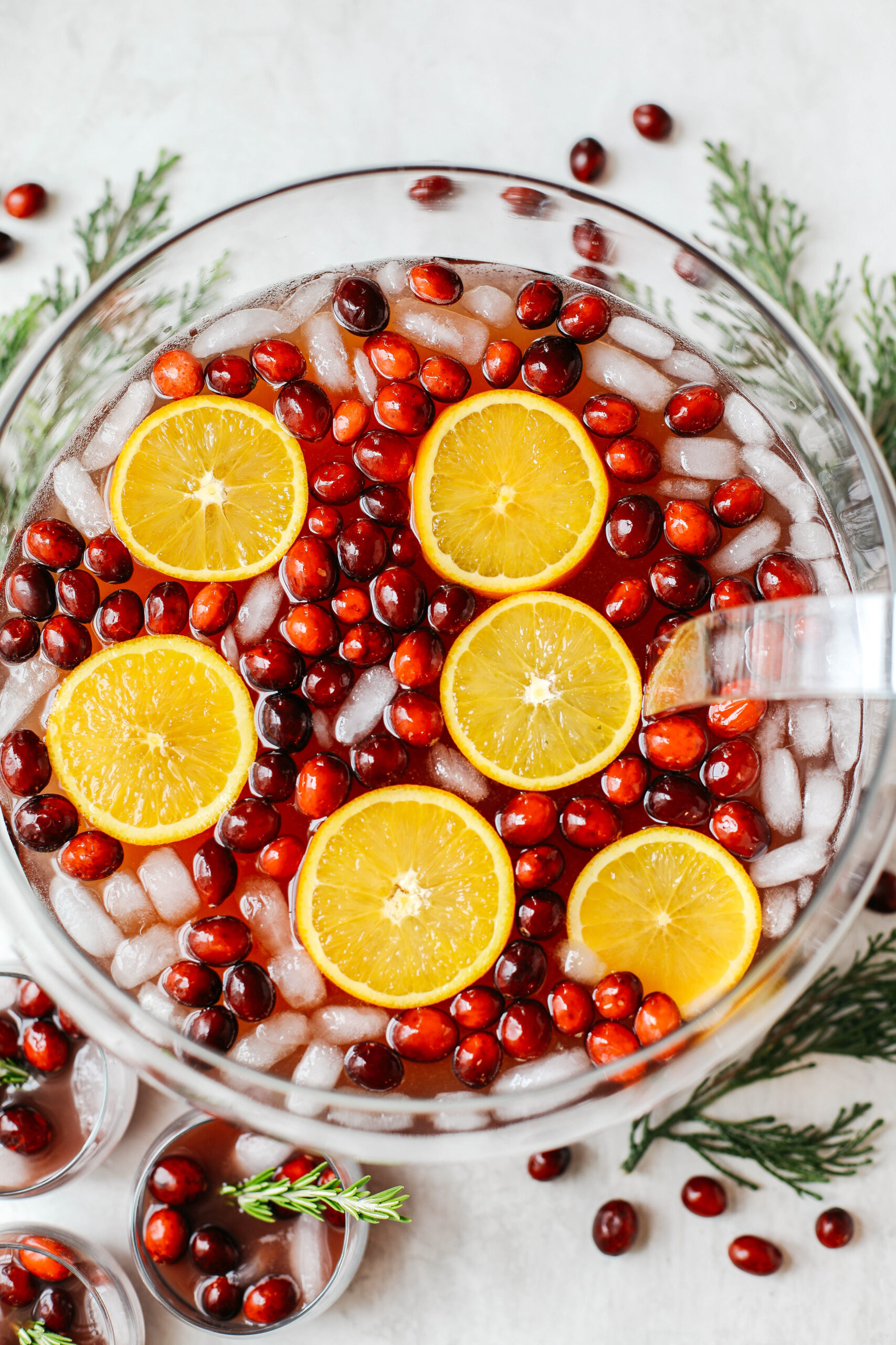 This Sparkling Christmas Punch makes the perfect addition to any holiday party or gathering with a delicious blend of cranberries and oranges all marinated together in one festive cocktail!