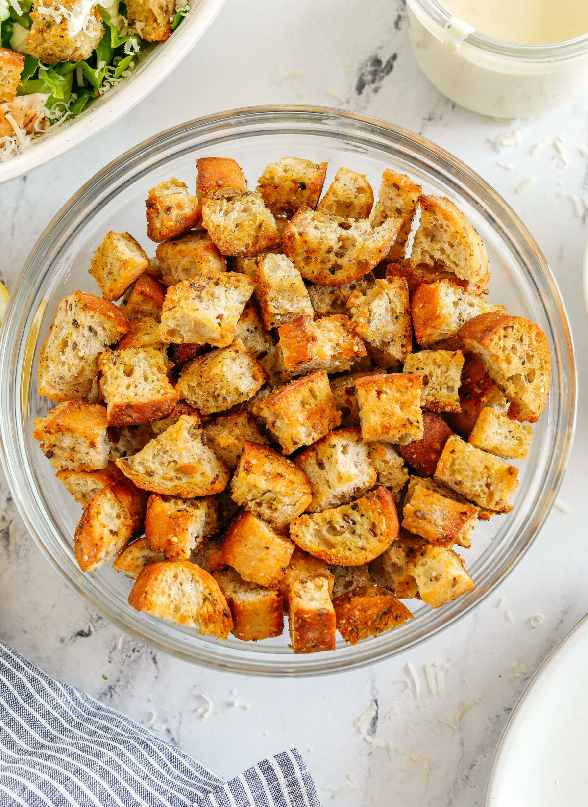 Learn how to make Easy Homemade Croutons that are crispy, garlicky and super quick to make!  Use them as a topping for salads, soups, stuffing and more!