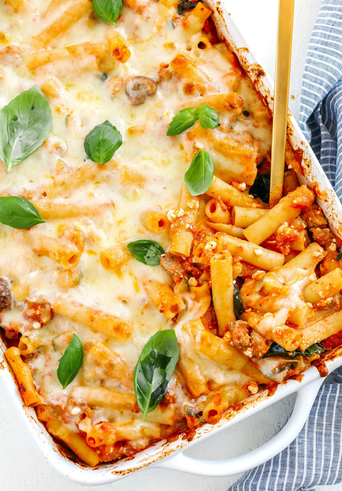 Comforting and delicious Healthy Baked Ziti packed with veggies, flavorful turkey sausage and makes the perfect weeknight meal the whole family will love!  Leftovers guaranteed!