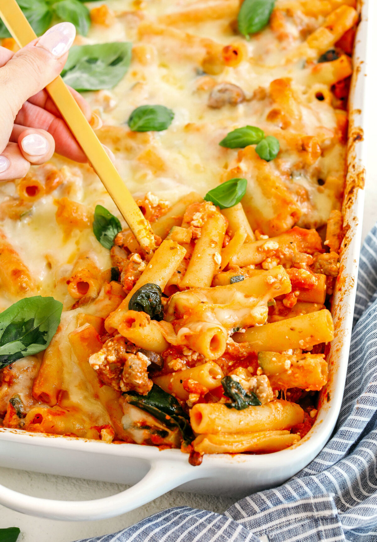 Comforting and delicious Healthy Baked Ziti packed with veggies, flavorful turkey sausage and makes the perfect weeknight meal the whole family will love!  Leftovers guaranteed!