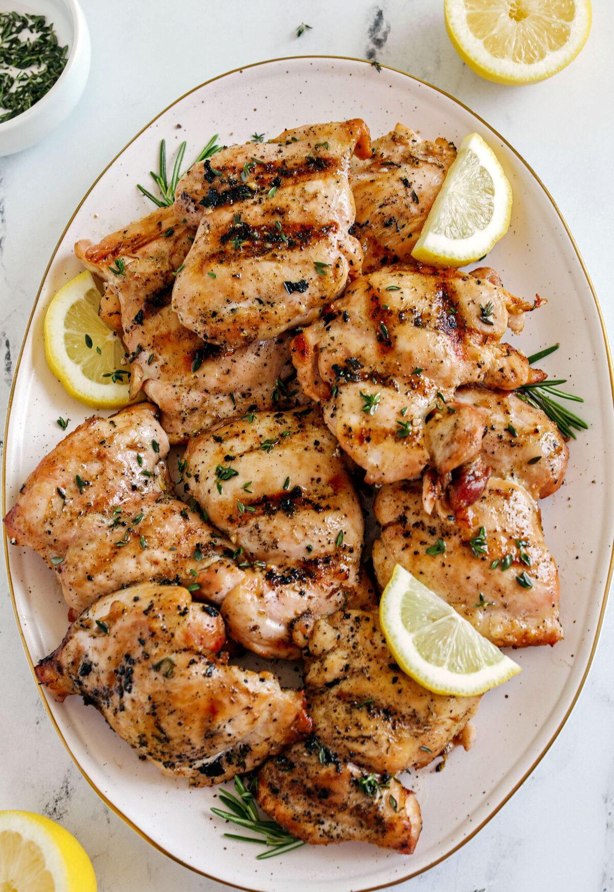 This Lemon Herb Grilled Chicken is easily made with just a few simple ingredients for a delicious, healthy meal!  Packed with so much flavor thanks to tangy lemon juice, tons of garlic, and fresh thyme!