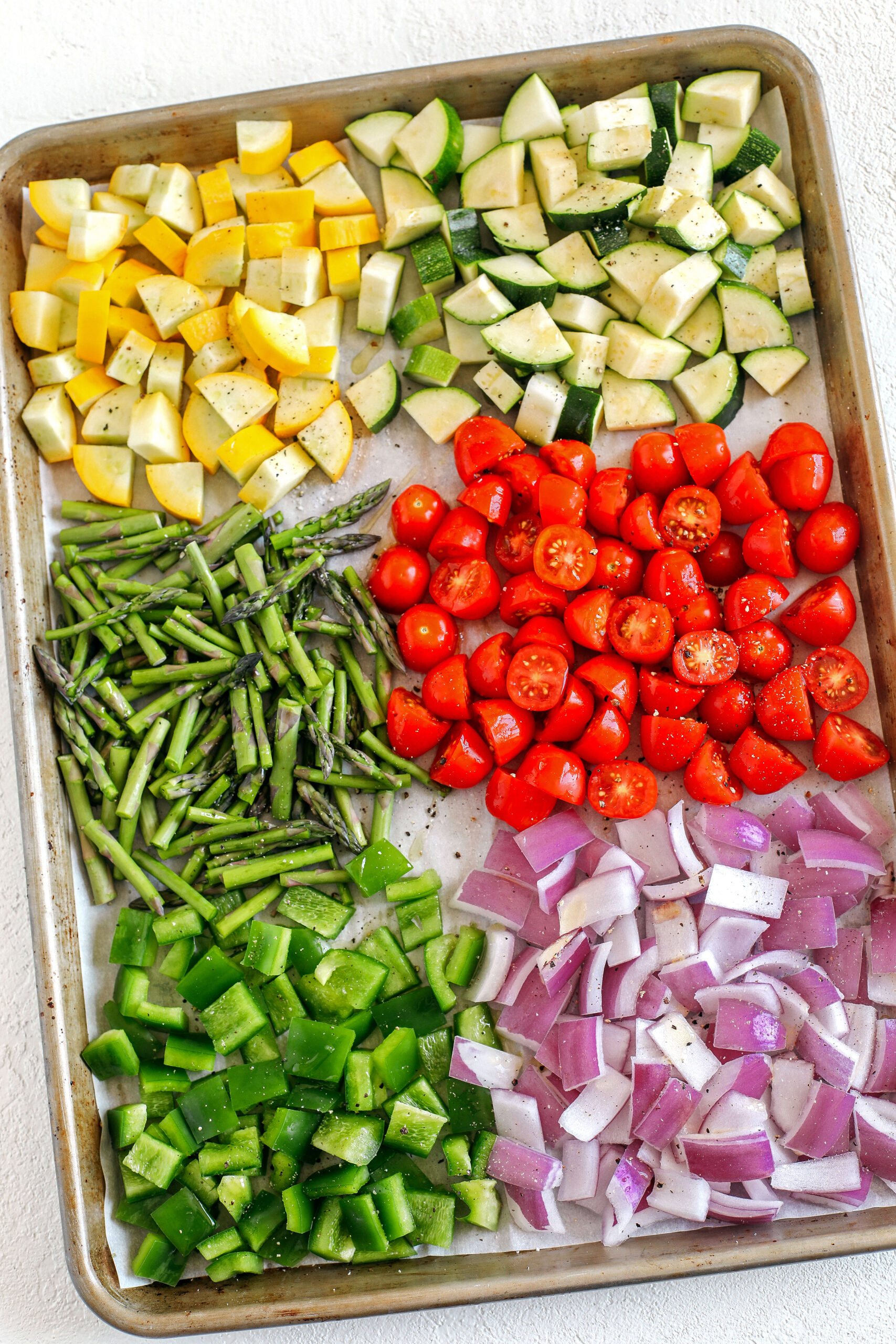 This EASY Roasted Veggie Pasta Salad is loaded with fresh ingredients like juicy tomatoes, zucchini, squash, asparagus, and bell pepper, all tossed together with a delicious lemon herb dressing!